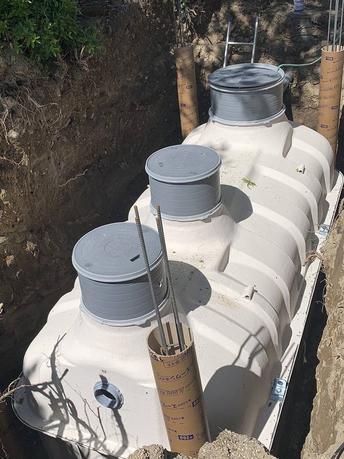 Septic tank with risers before backfill