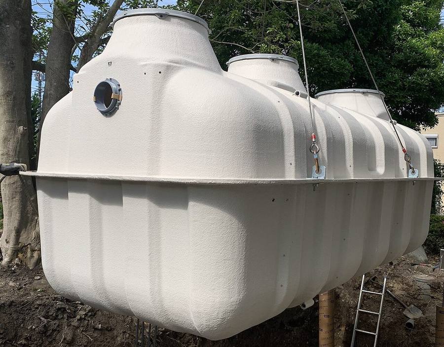 Septic tank lifted into place